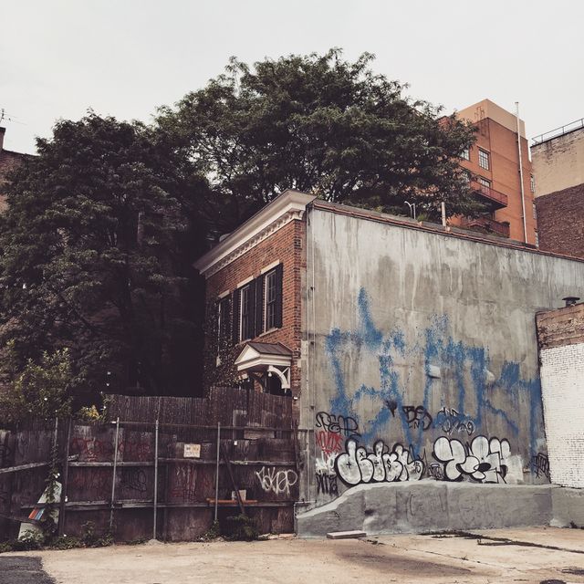 Nyc oasis. A lovely old brick home with a garden amid concrete