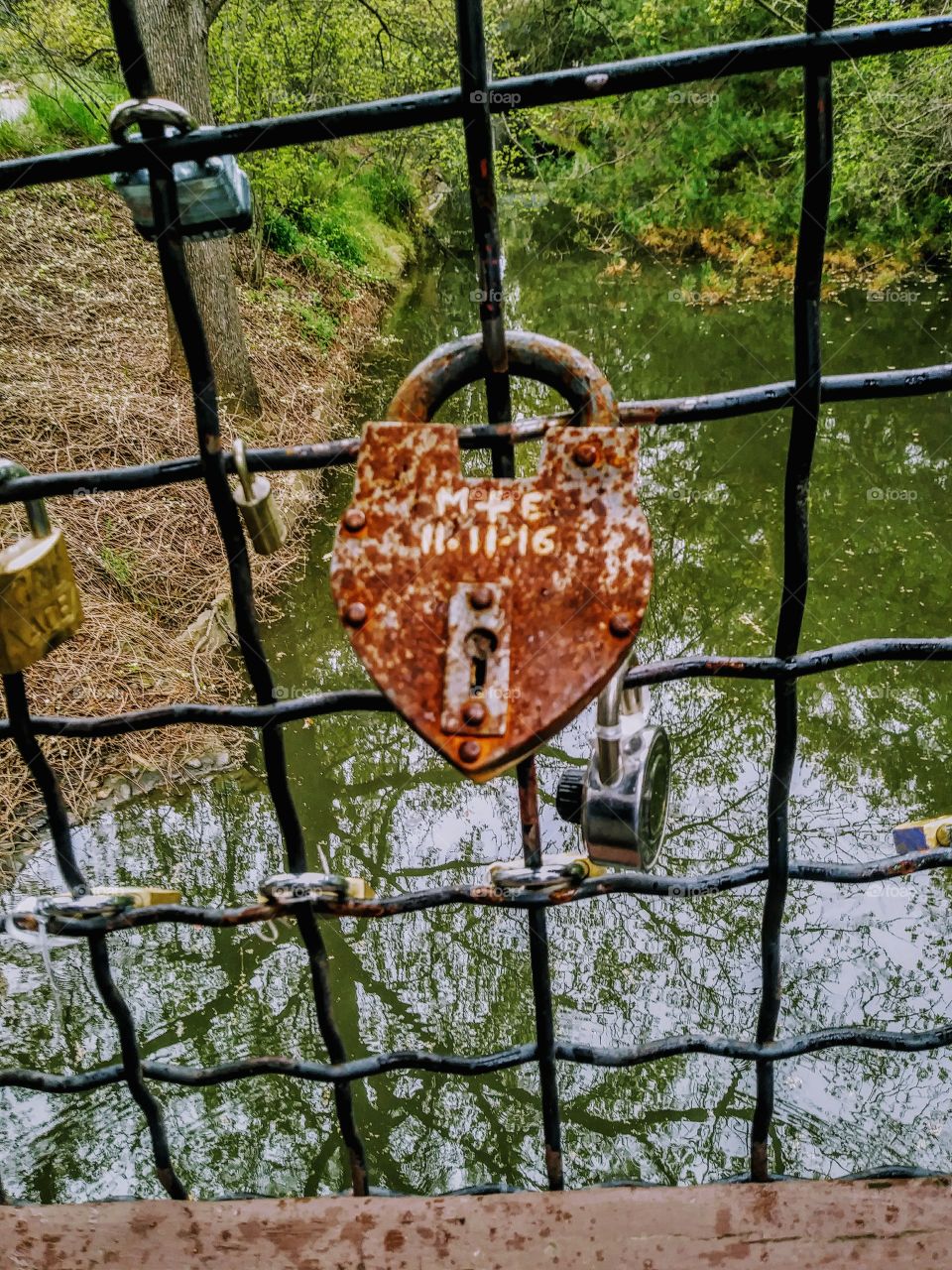 m + e 11/11/16 large heart shaped love lock on bridge