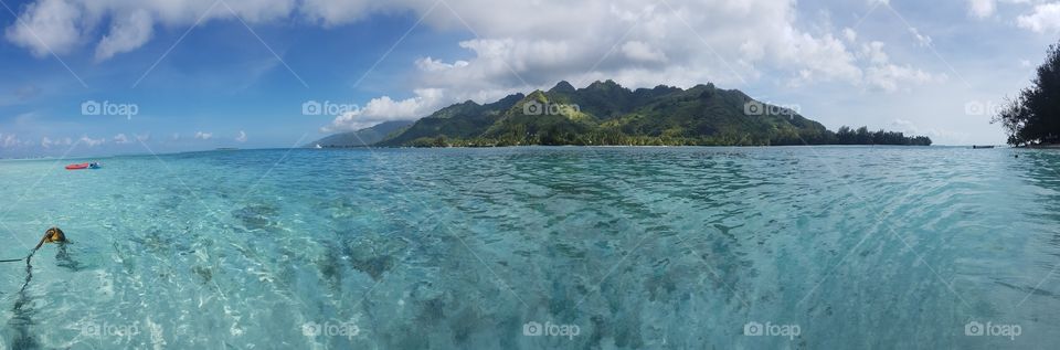 Panorama of moorea island close to tahiti taken from the ocean clearwater sea. Glimpse of paradise.