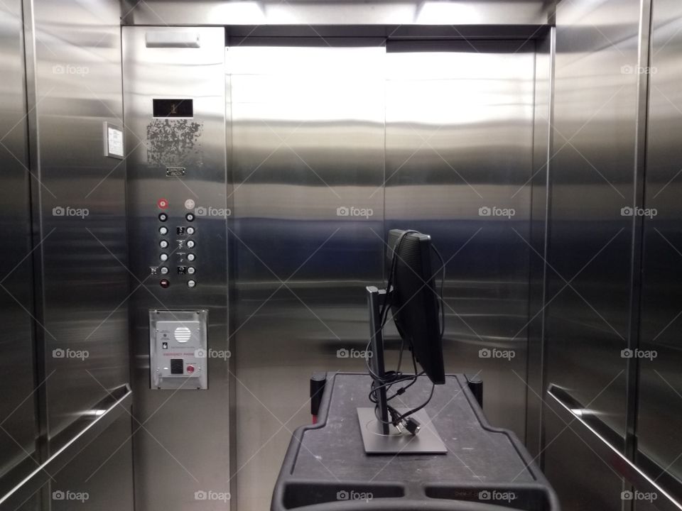 elevator and cart with computer monitor