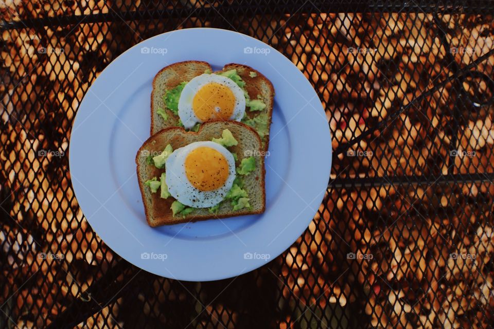 avacado toast with a Sunny Side up Egg! saw a golden photo opportunity with those eggs so I decided to take a photo of them!