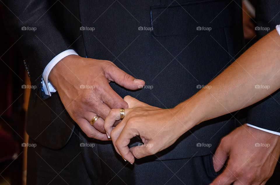 Bide and groom holding hands