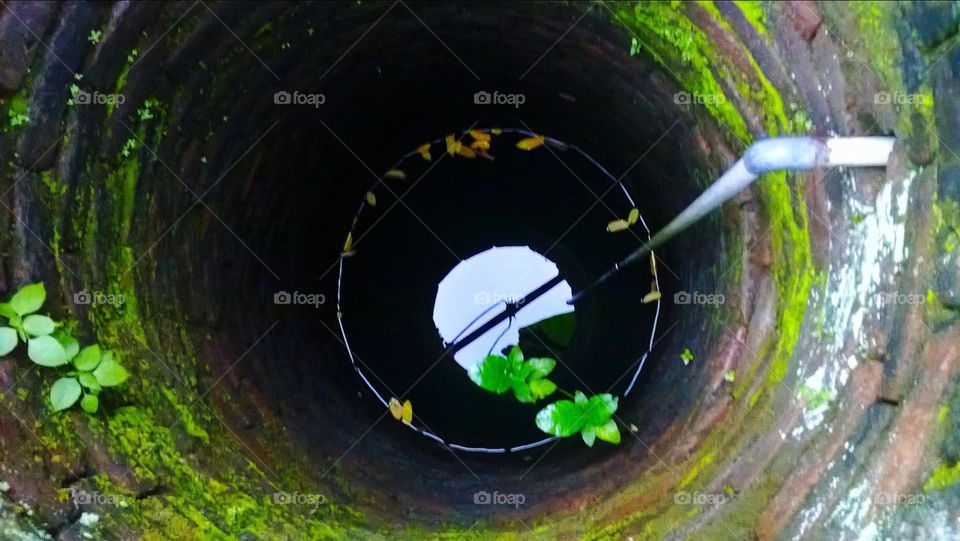 The hole in the well looks like water.