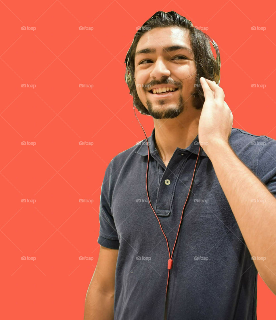 Man Enjoying Music From Headphones