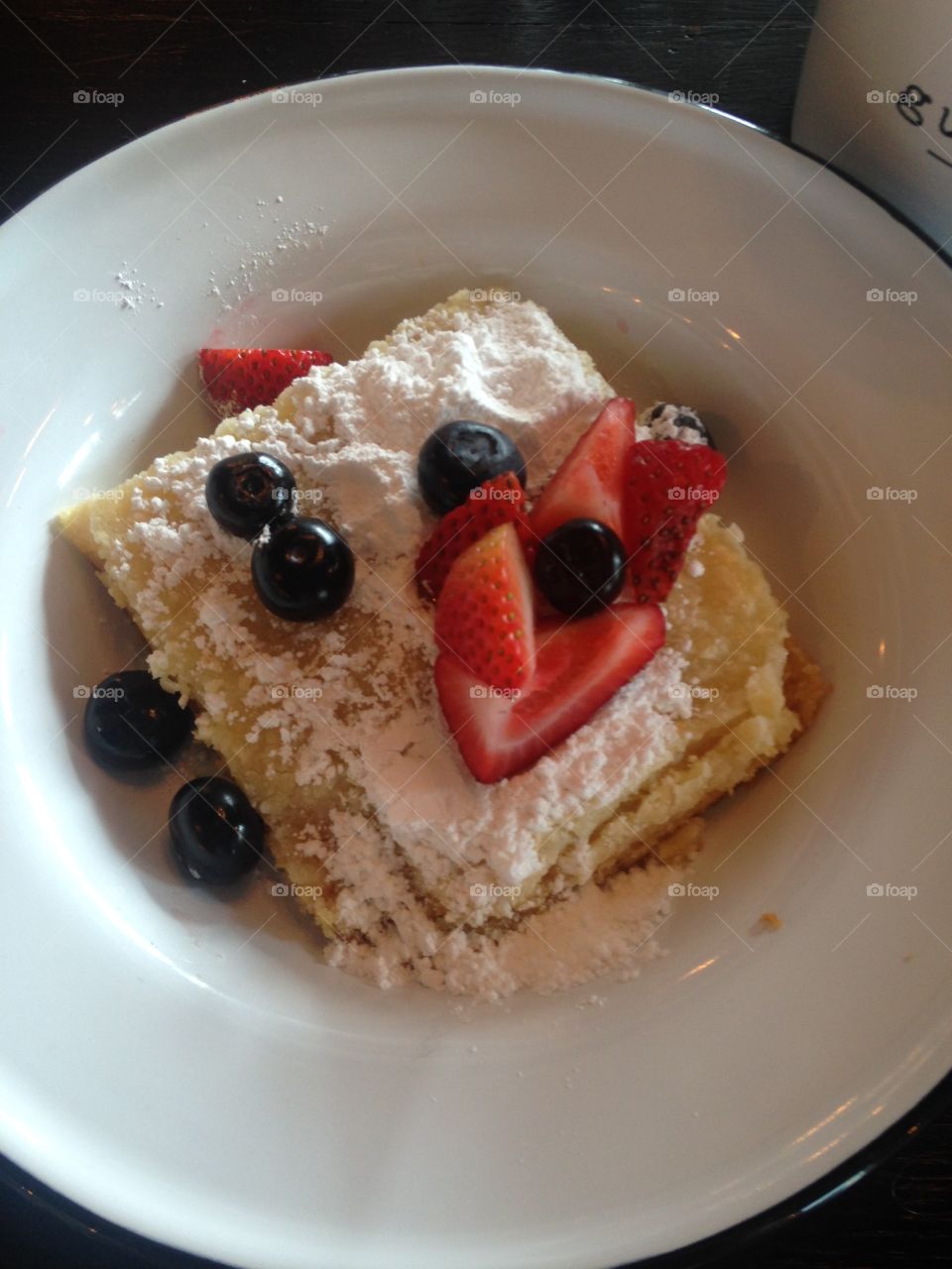 Delicious pound cake topped with locally sourced berries from a brunch with friends