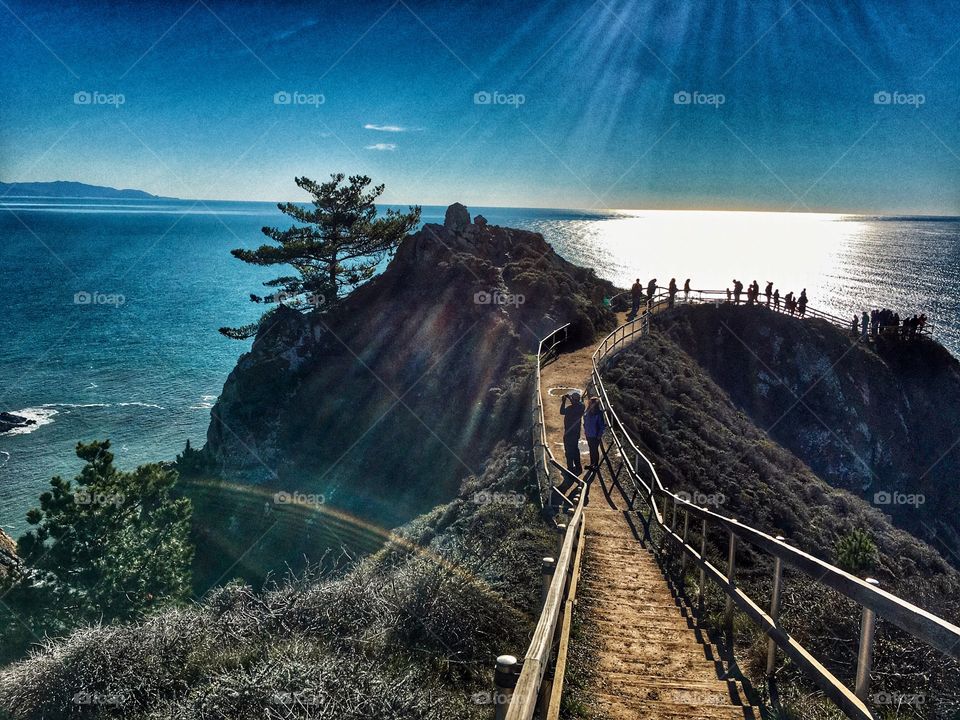Sun rays shining down on Muir Beach overlook in California. Spectacular view of the rugged California coastline near San Francisco.