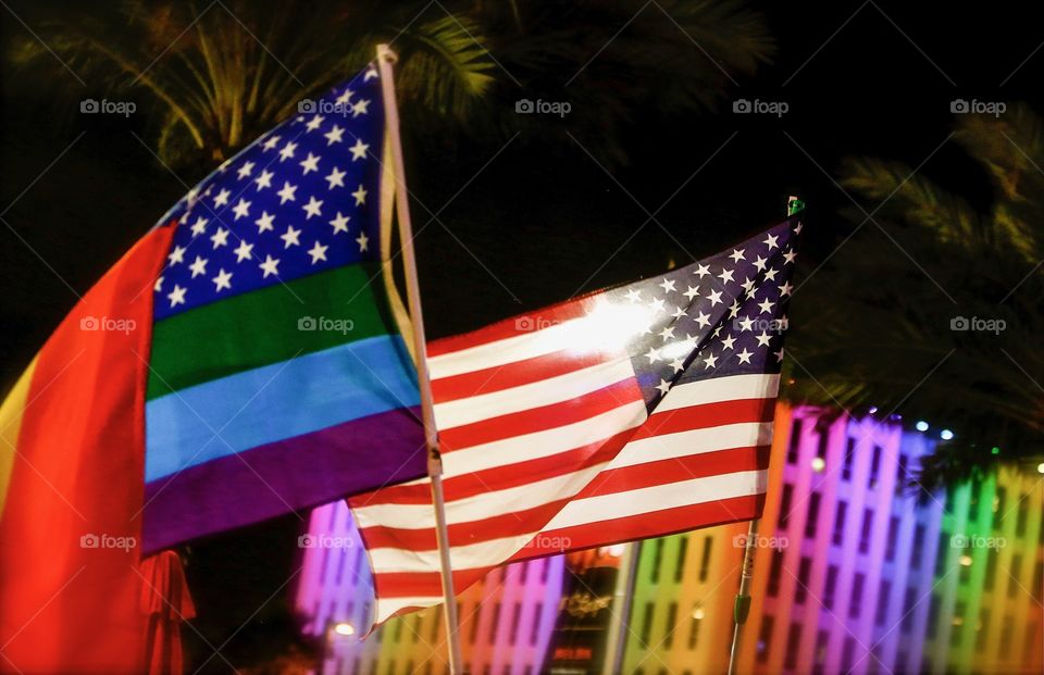 United States flag and lgbq pride Rainbow flag. Orlando Florida Pulse Night club tribute