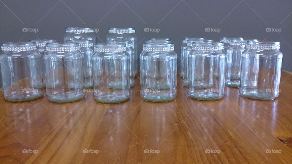 Bling It Up. Repurposed jars made into vases and candle holders for the eco-friendly bride.