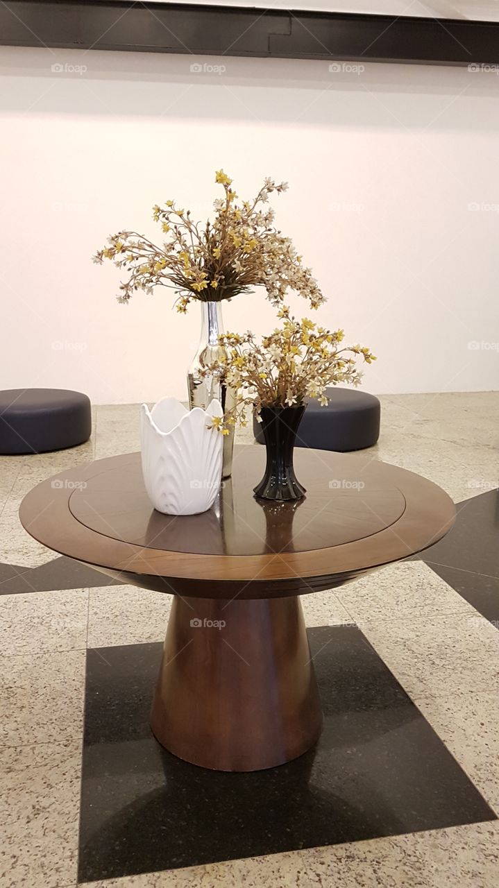 small round table with flower