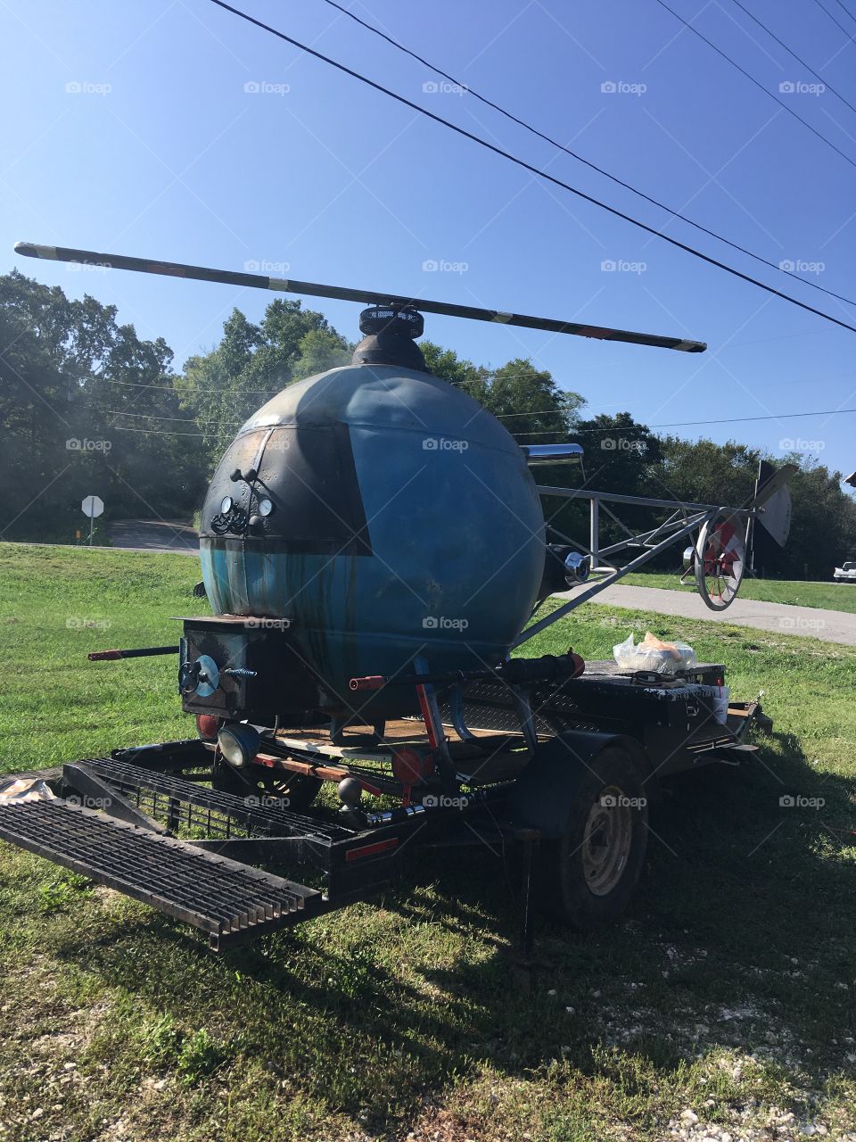 This has gotta be a hillbilly cooker. The propeller spins and it has two hotdog shooters.