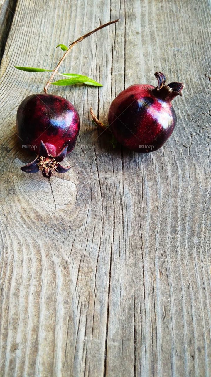 pomegranates on wood