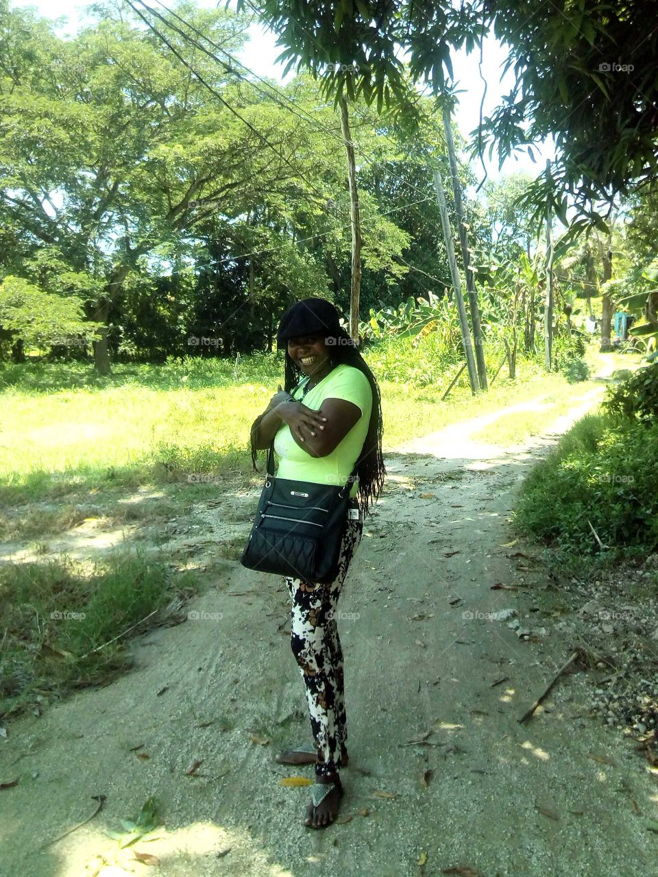 she is standing under a big mongo tree so ware she is shade but if you look on the other side the sun is very hot