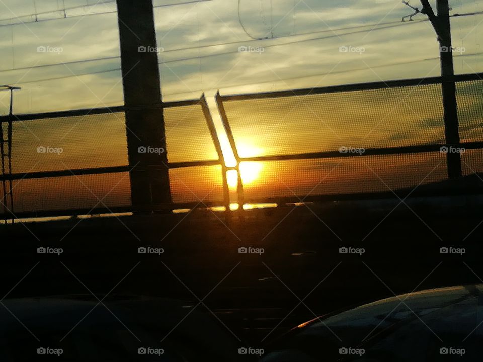The sun and the fence