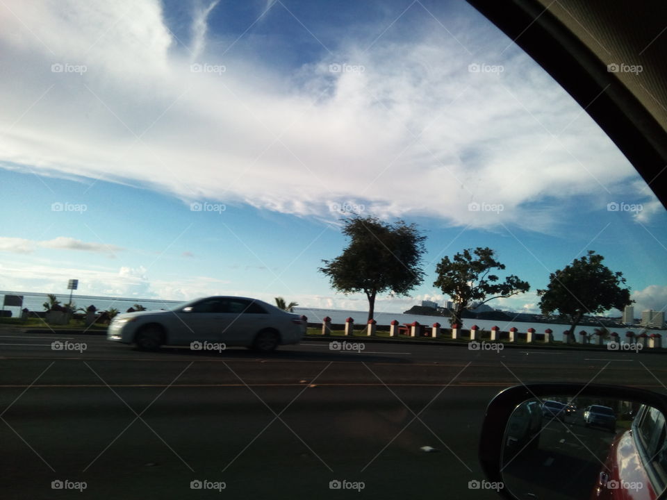 white clouds and car