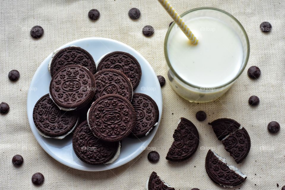 glass of milkand Oreo cookies