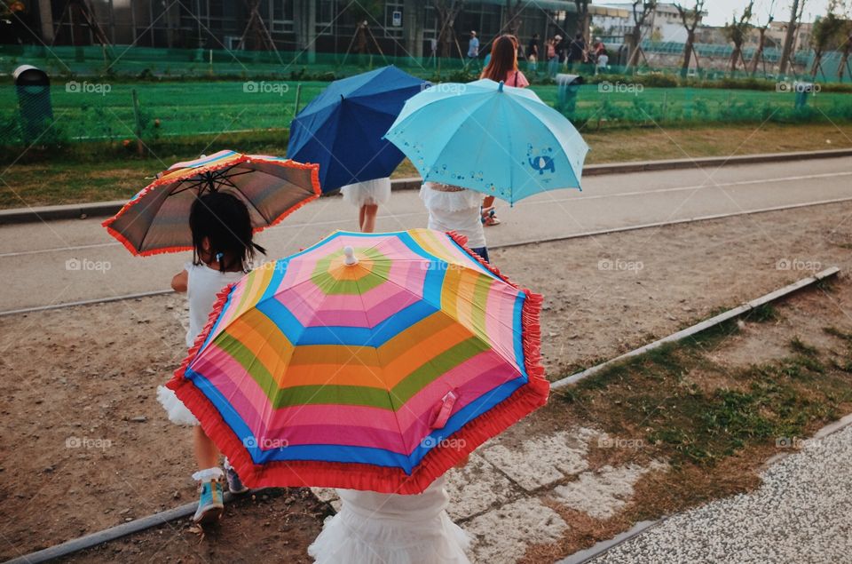 Children with colorful umbrellas
