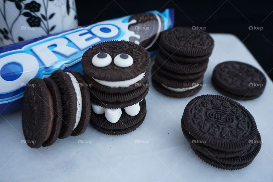 Oreo biscuits stacked up as a Cookie Monster with marshmallow legs and goggly eyes