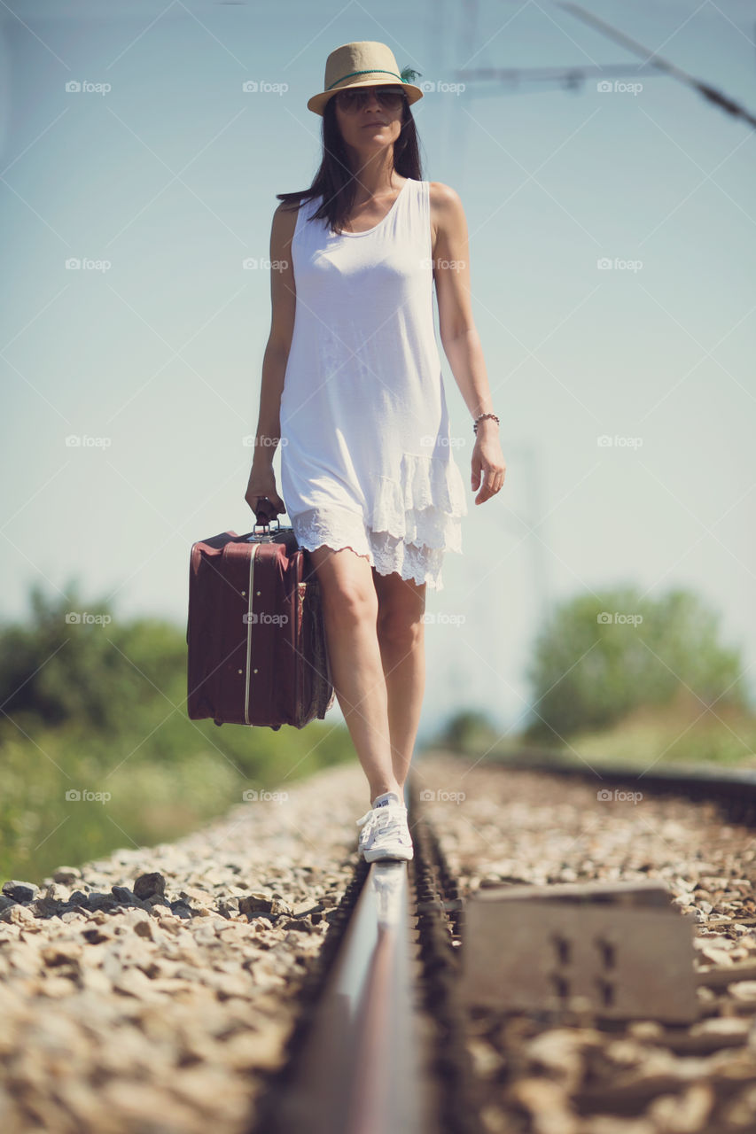 Portrait of a woman carrying briefcase