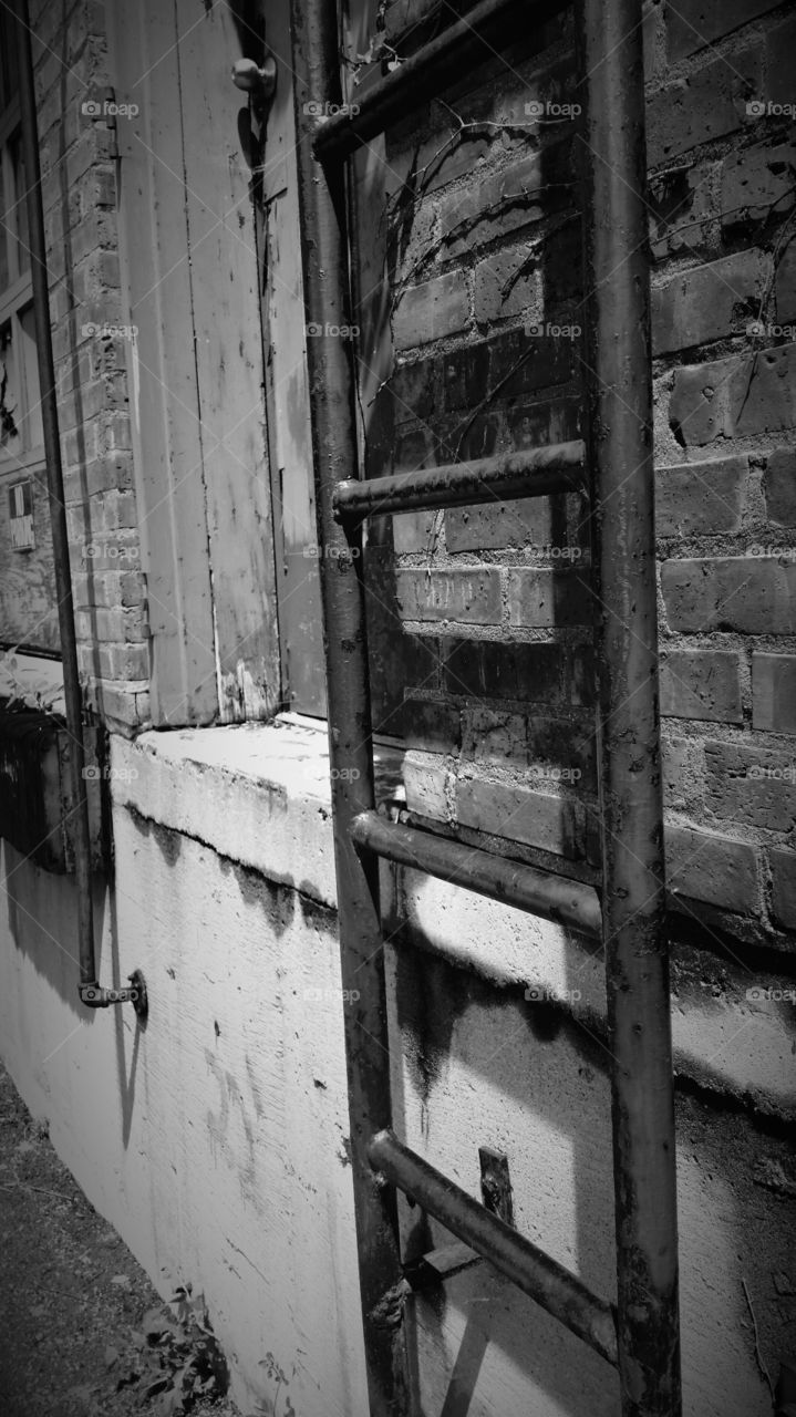 Ladder. Broken ladder on old abandoned building
