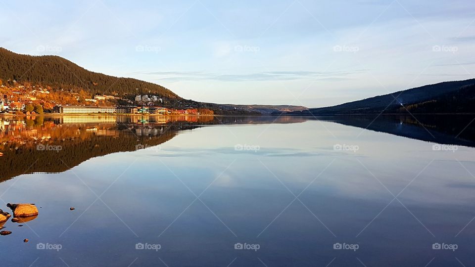View of city reflected on lake