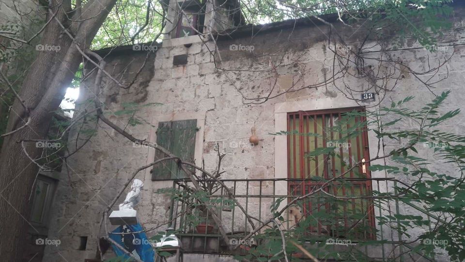 old house in middle of Split with some scary items