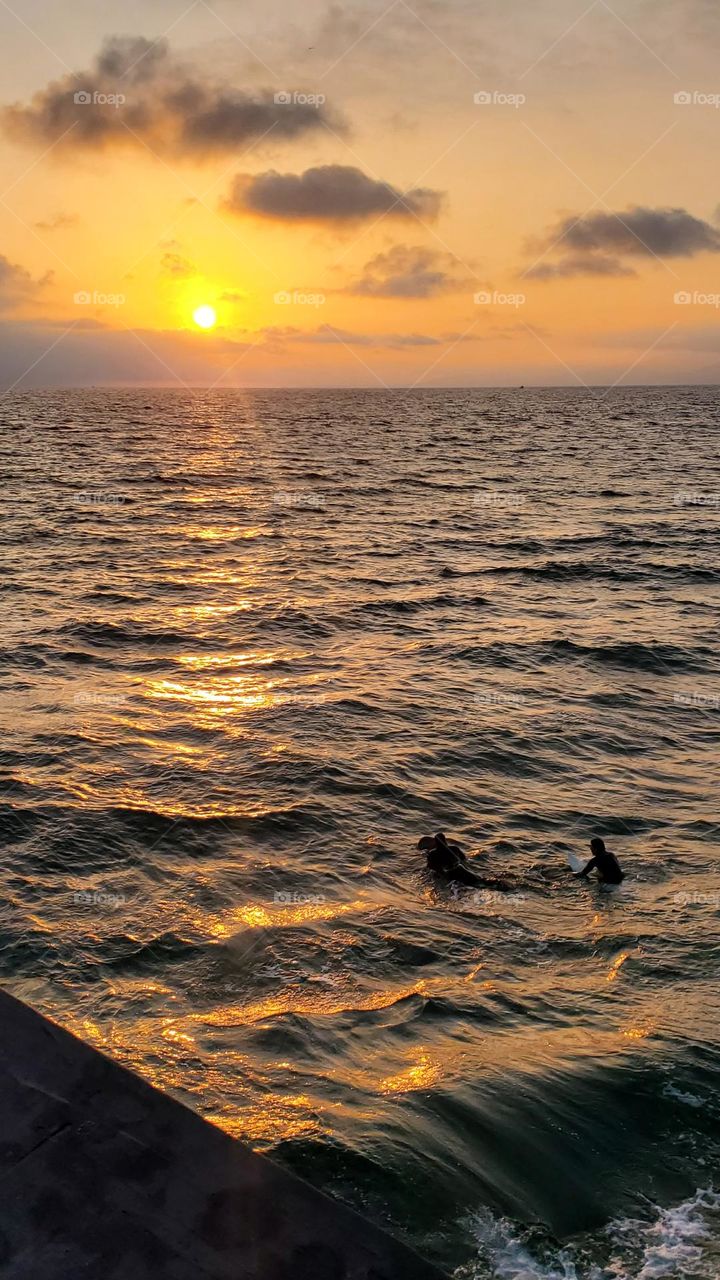 Dudes Surf to the Sun