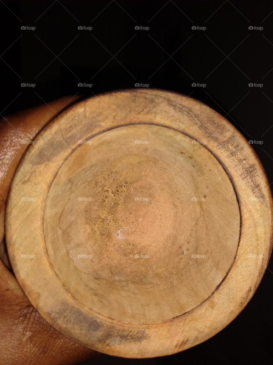 Circle within circle shaped wooden pestle