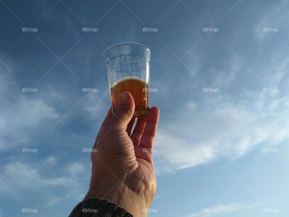 Beautiful cup of tea embraced foggy sky.