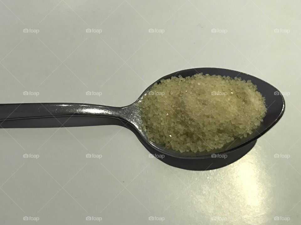 A spoon of brown sugar