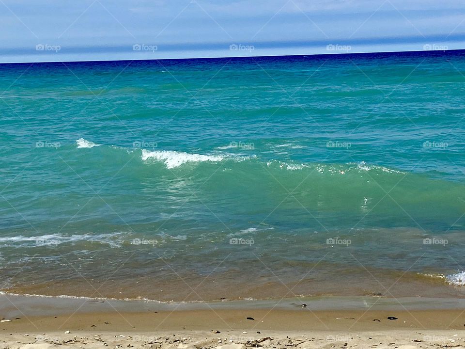 Blue waters of a Lake Huron beach in Northern Michigan