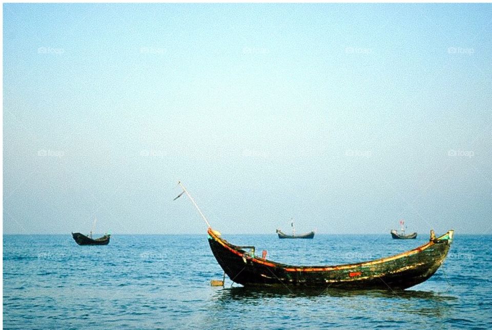 Traditional Bangladeshi fishing boats floating on Bay of Bengal 