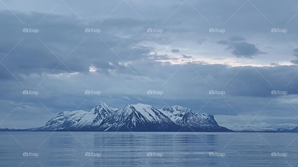 Snowy mountain in sea
