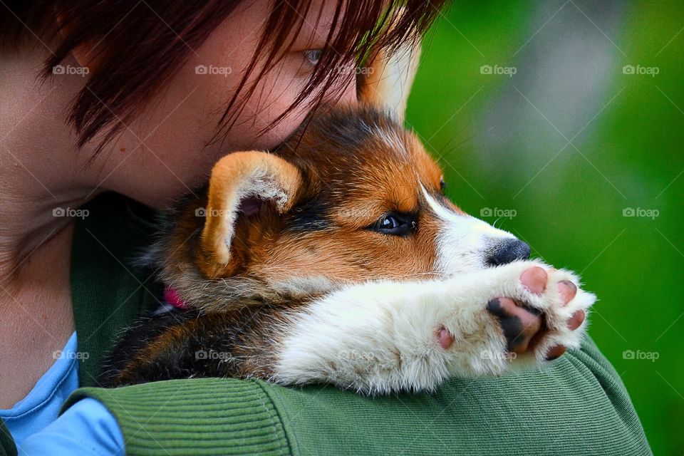 Girl cuddling with a pup