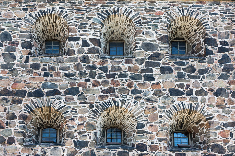 Windows on old stone fortress in symmetry 