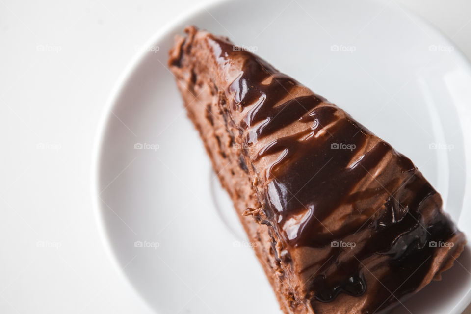 Slice of chocolate cake on plate