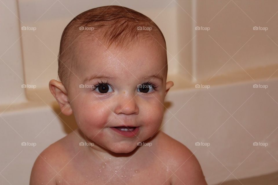 Close up smiling baby bath