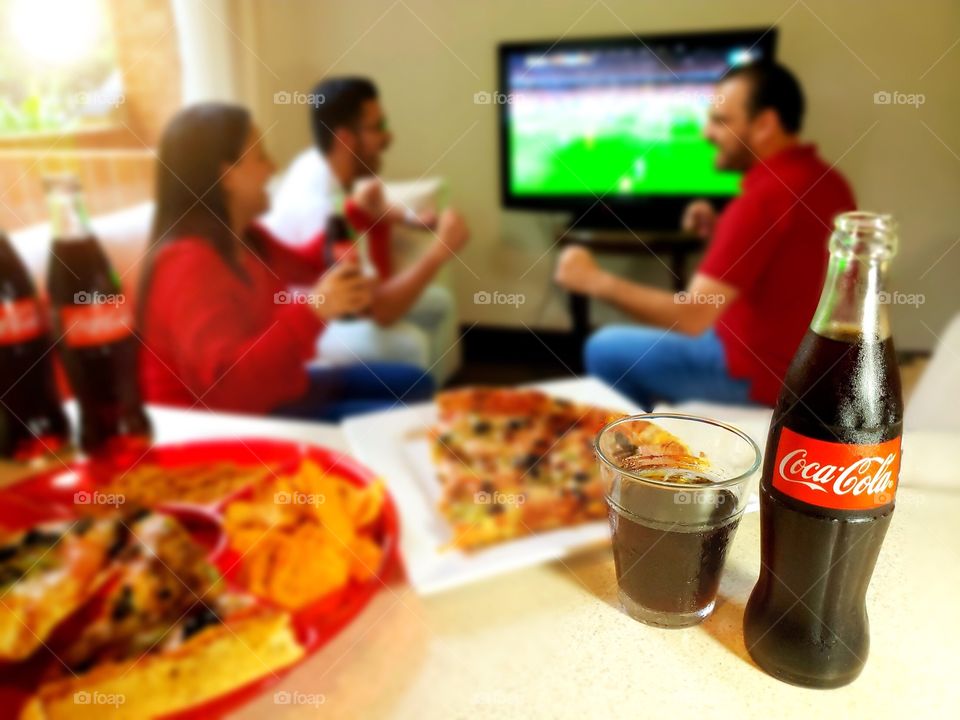 Enjoying the game with CocaCola!