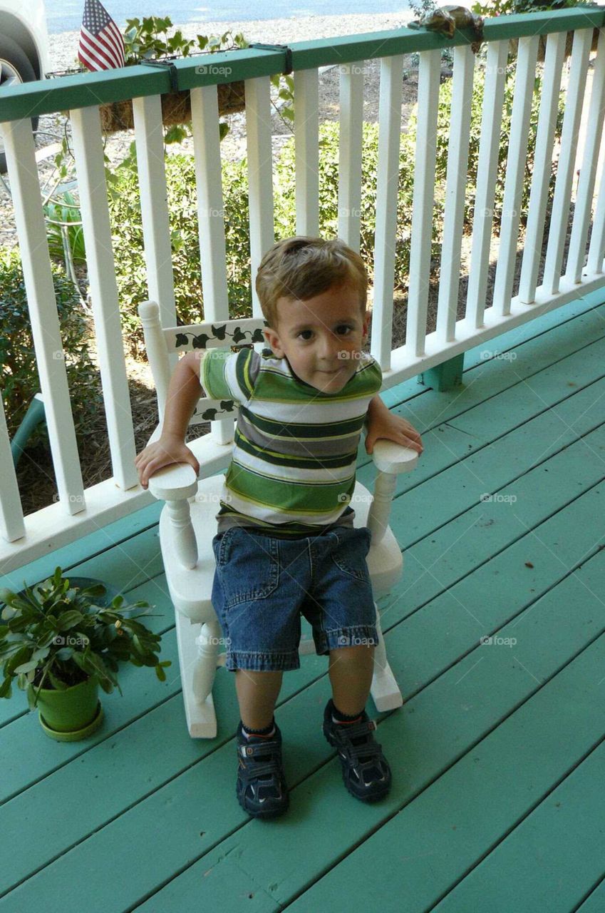 Boy in a rocking chair