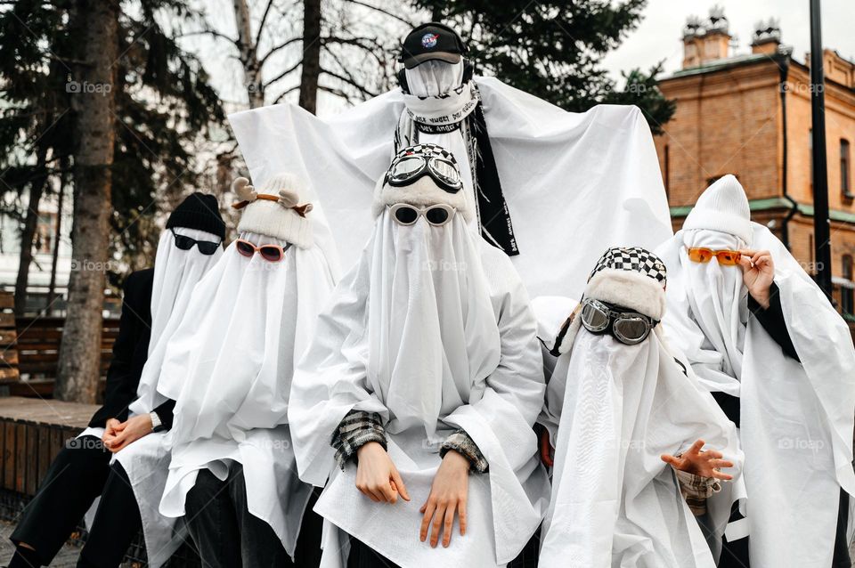 Teenagers in ghost costumes. Halloween party