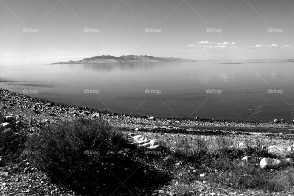 Stansbury Island in the middle of the Great Salt Lake - taken from Antelope Island, also in the middle of the Great Salt. Lake - black and white