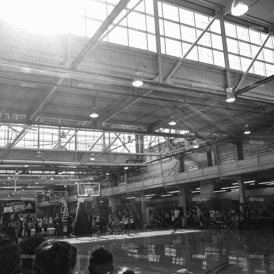 Light glistening on the kids playing basketball