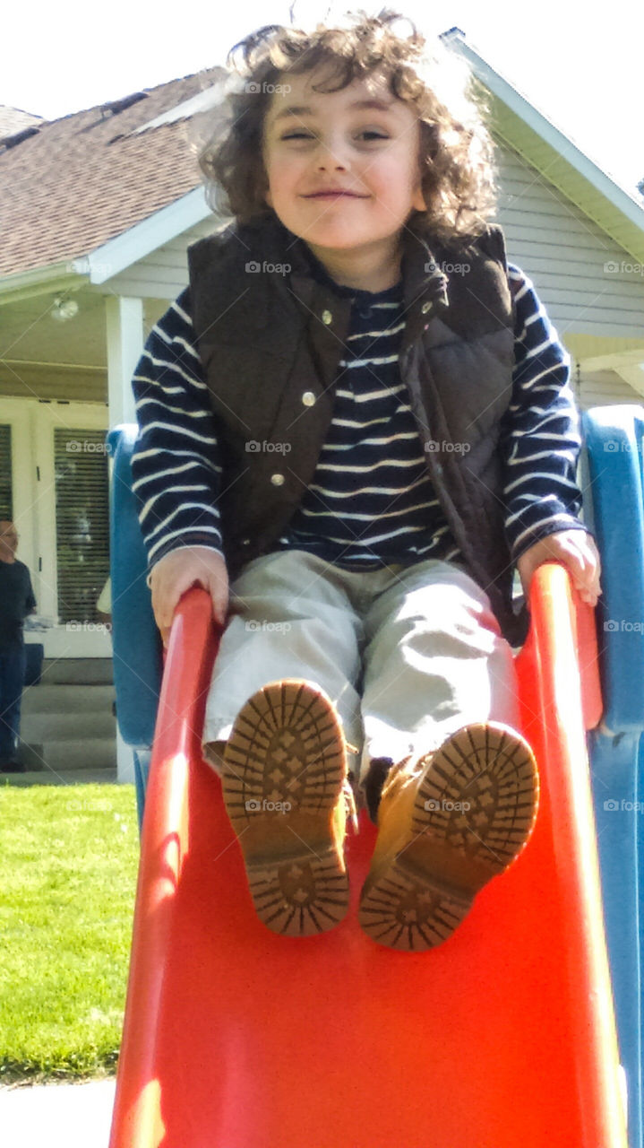 boy playing with huge smile