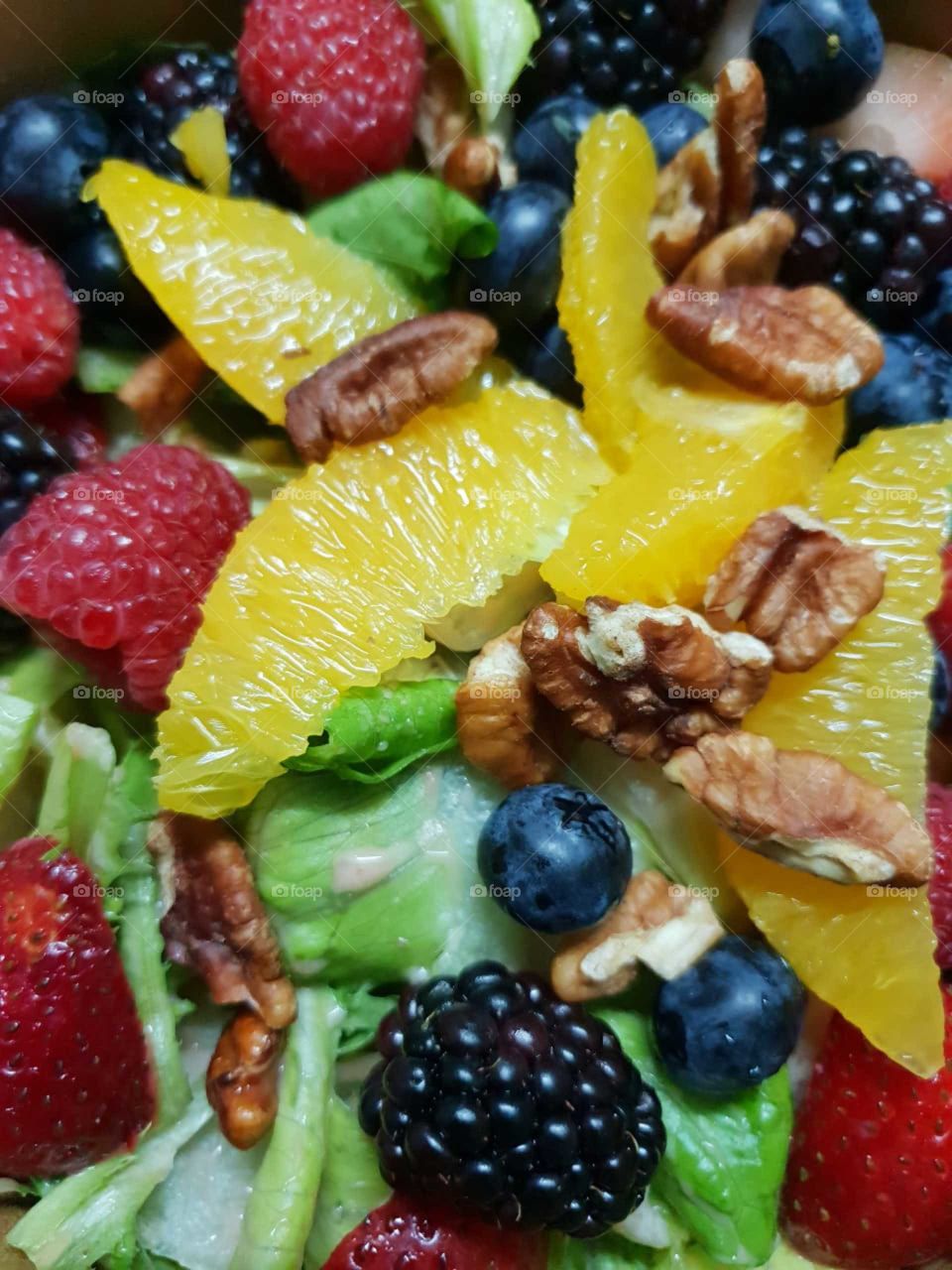 A delicious grasp of color in a bowl, A fruity nutty salad!