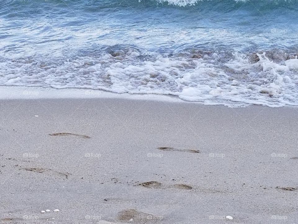 footprints and waves