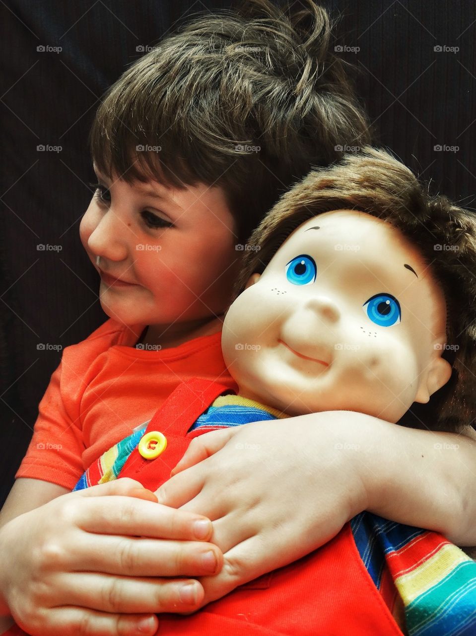 Little Boy And His Doll. Young Boy With A Doll That Looks Like Him
