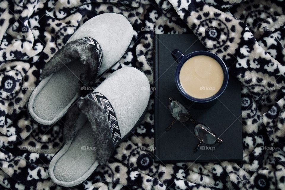 Slippers and coffee with a good book to read