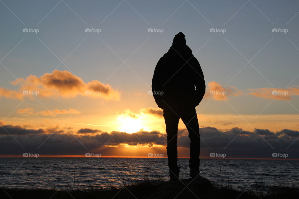 Silhouette of man at beach during sunset