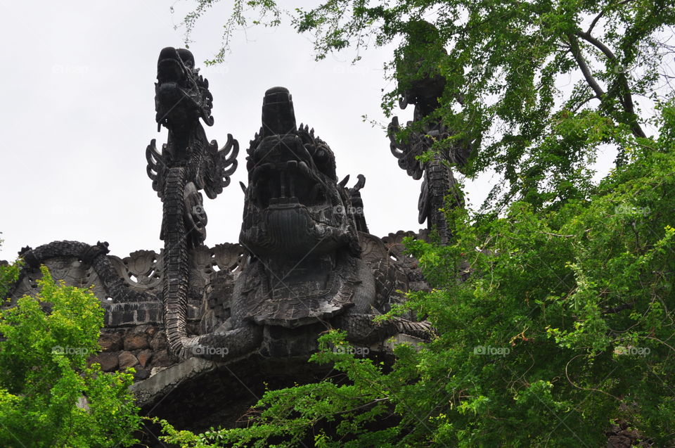 monument in the forest looks like dragon that use for religious  ceremony