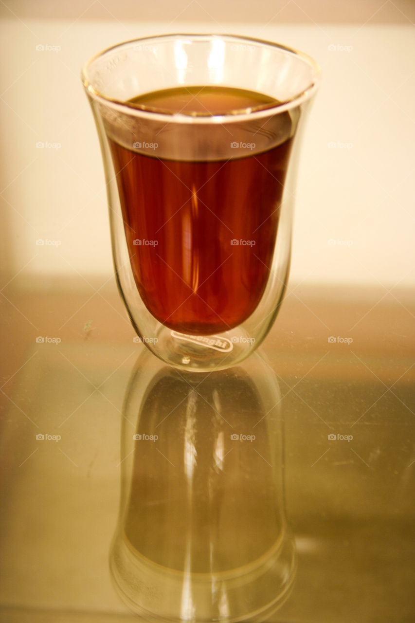 Symmetry. This reflection of a glass with rooibos is an example of perfect symmetry in everyday life