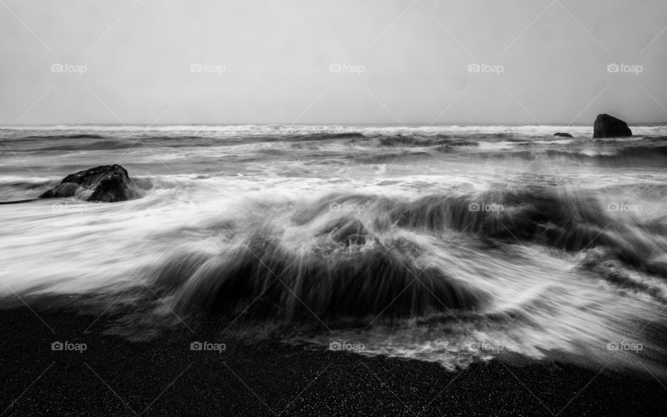 Sea wave over sandy beach
